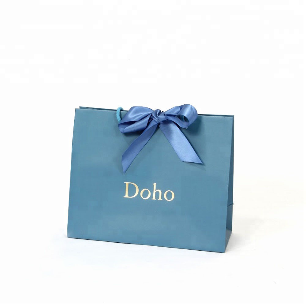 Bolsa de regalo de papel de embalaje de boutique cosmética hecha a mano personalizada de moda de alta calidad al por mayor