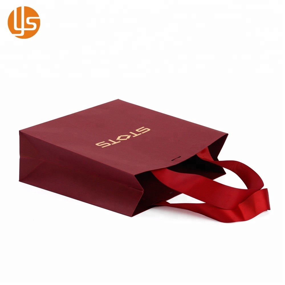 Китай Производство Оптовая торговля Индивидуальный дизайн Упаковка одежды ручной работы Красный Необычный бумажный пакет для покупок